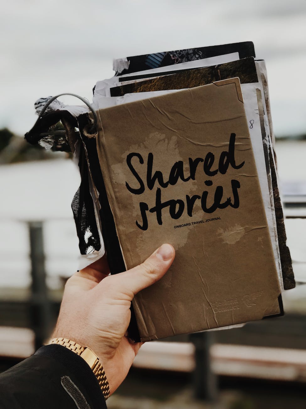 photo of person holding book