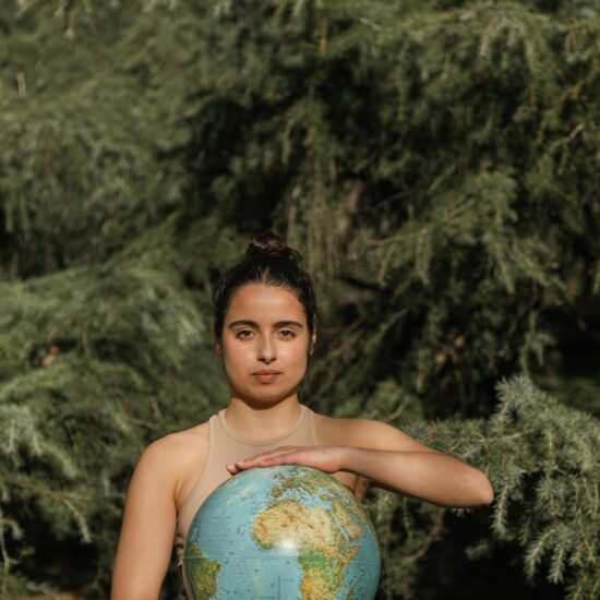 woman holding a globe