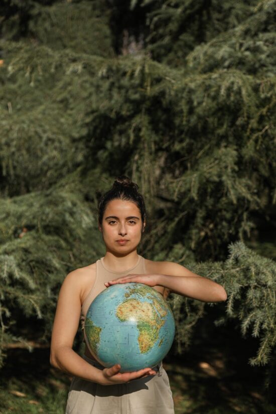 woman holding a globe